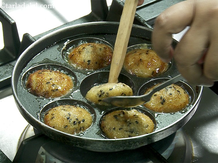 Step 31 – You need to cook them on a low flame as the&nbsp;unniyappam&nbsp;brown very fast due to …