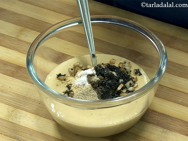 Step 18 – Baking soda. Adding&nbsp;of baking soda to give a soft, fluffy texture to the <strong>unni appam</strong>.