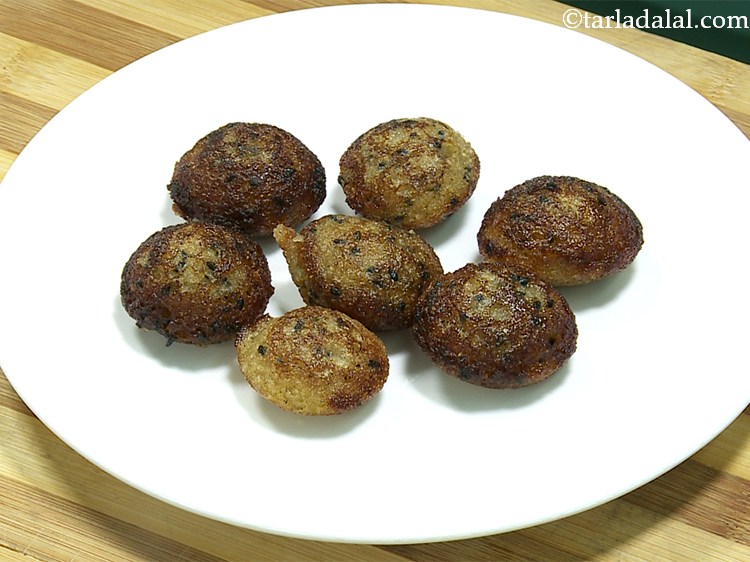 Step 23 – Once the <strong>unni appam</strong> are cooked from both sides, remove them on a plate.