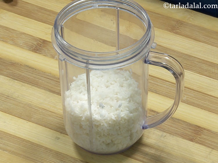 Step 5 – Transfer the soaked and drained rice into a mixer jar.