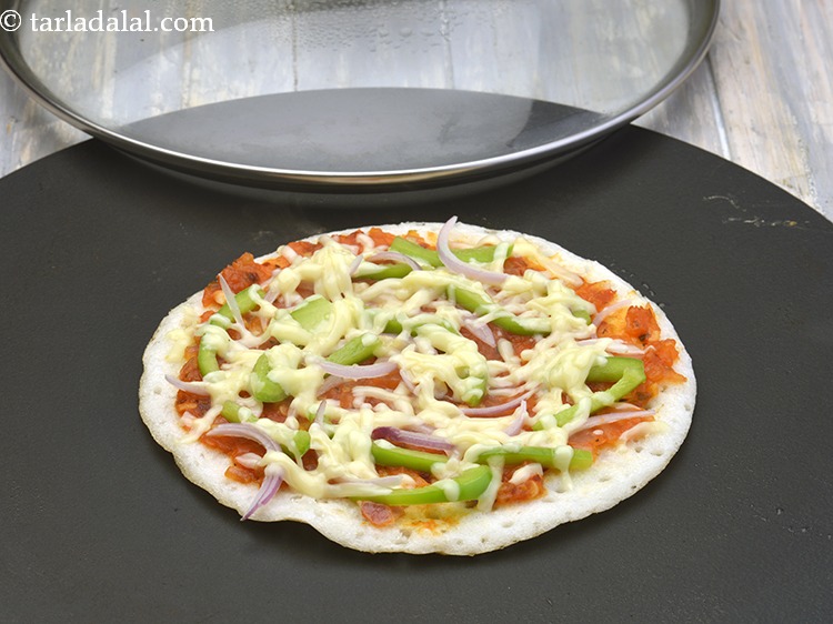 Step 10 – Cook on a slow flame for 3 minutes or till the cheese melts. Our pizza …