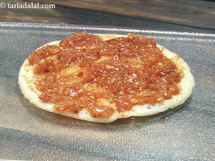 Step 15 – Put 2 tbsp of pizza sauce over it and spread it evenly. Even that is …