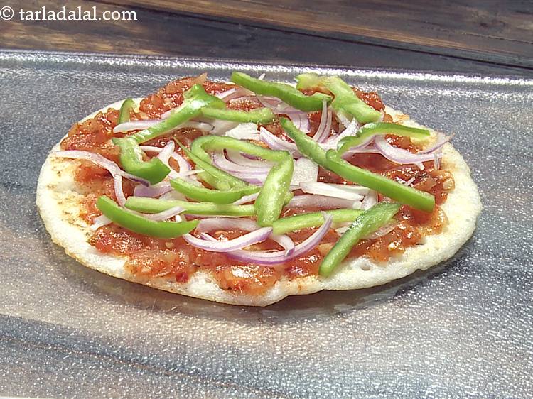 Step 7 – Sprinkle capsicum evenly over it. We are using onions and capsicum as a topping but …