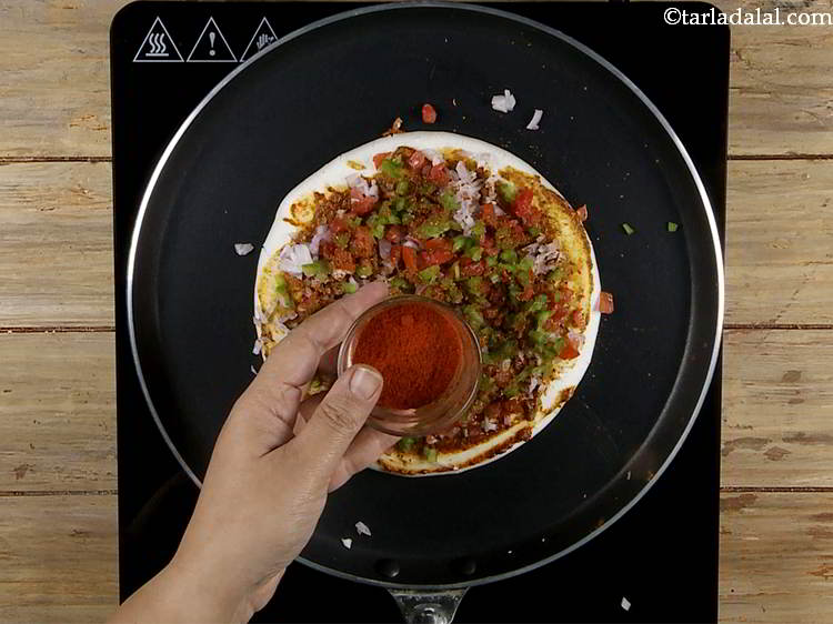 Step 16 – Sprinkle &frac12; tsp of chilli powder for that little spice.