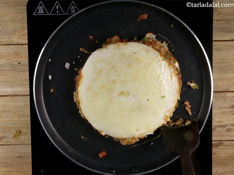 Step 24 – Trim off the extra batter and vegetables from the circumference using a sharp flat laddle …