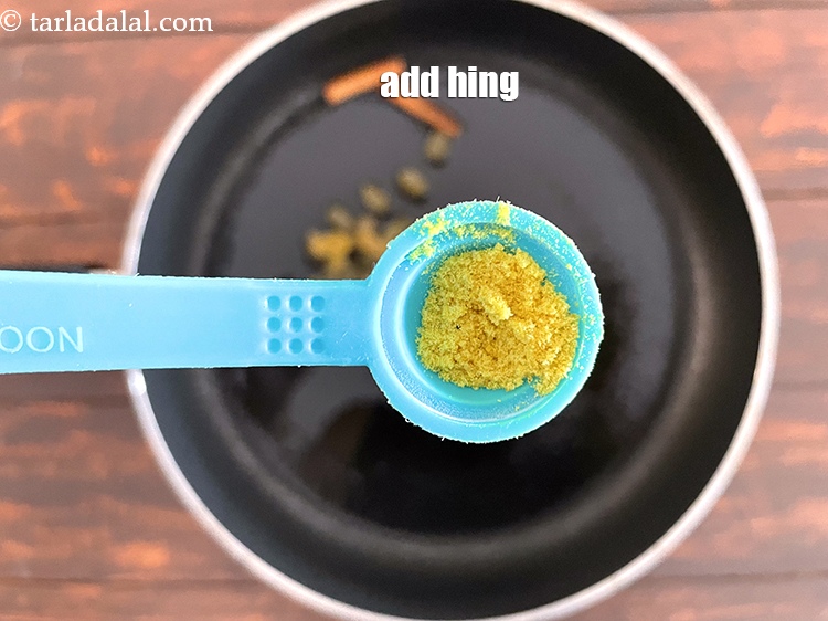 Step 13 – Add&nbsp;<meta charset="UTF-8" />a pinch of&nbsp;<a href="glossary-asafoetida-hing-113i">asafoetida (hing)</a>.