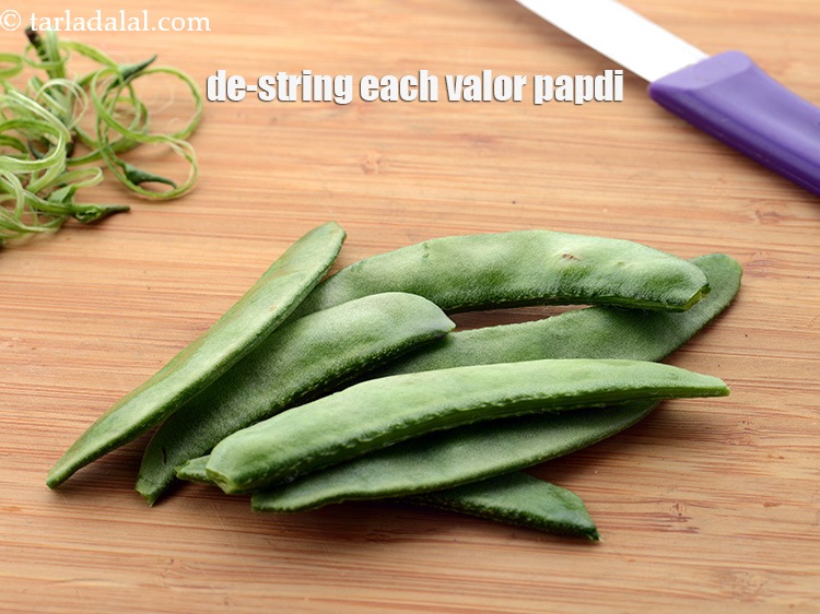 Step 7 – De-string each valor papdi using a knife from both the sides and discard the strings.&nbsp;