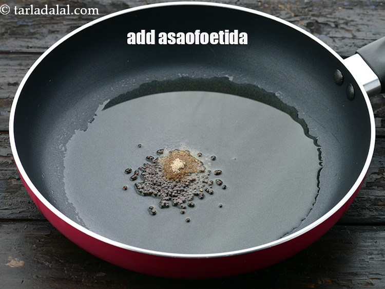Step 21 – Add 1/4 tsp&nbsp;<a href="https://www.tarladalal.com/glossary-asafoetida-hing-113i">asafoetida (hing)</a>.&nbsp;