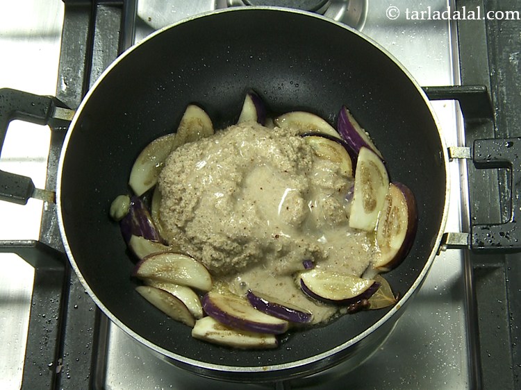 Step 26 – Add the prepared paste and 2 tbsp water.