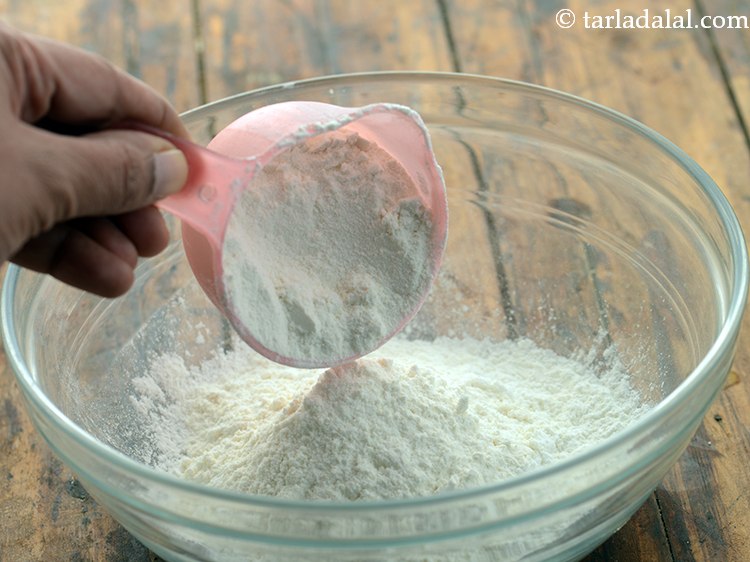Step 4 – Add plain flour in a deep bowl.