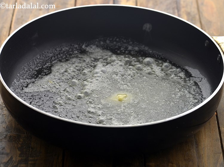 Step 61 – Take a broad non stick pan, heat 1/2 tsp of butter.&nbsp;