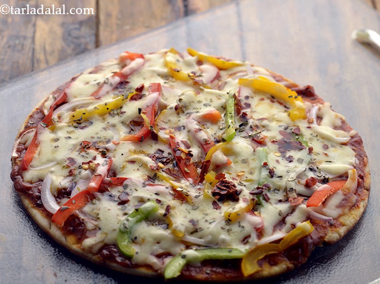 Step 64 – Transfer the&nbsp;<strong>tava pizza recipe | tawa pizza | Indian style veg tava pizza |</strong><strong>&nbsp;</strong>on a …