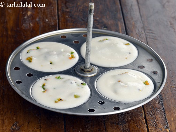 Step 25 – Finally top it with &frac12; tbsp of the idli batter evenly over it.