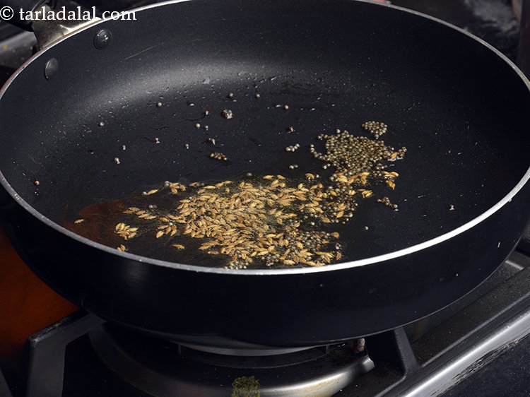 Step 1 – Heat the oil in a broad non-stick pan, add the mustard seeds and cumin seeds.