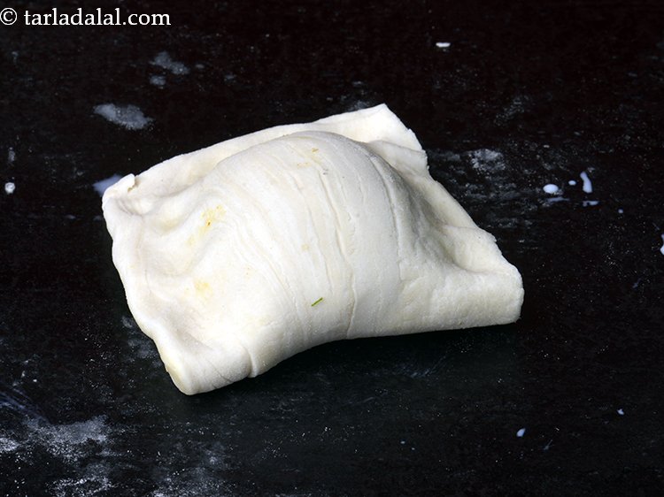 Step 24 – Apple little milk on all the sides and fold over the other half of the …