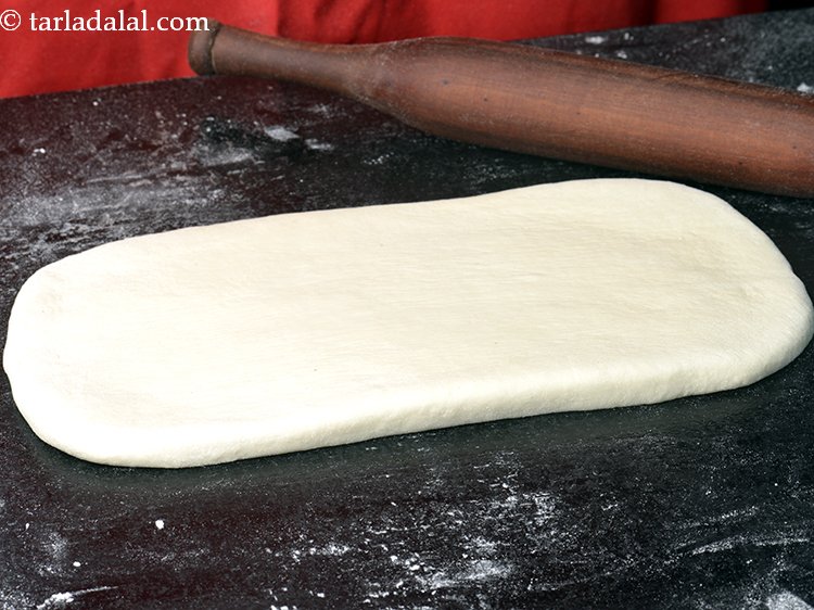 Step 8 – Dust the flat surface with a little plain flour. Place the dough on it and …