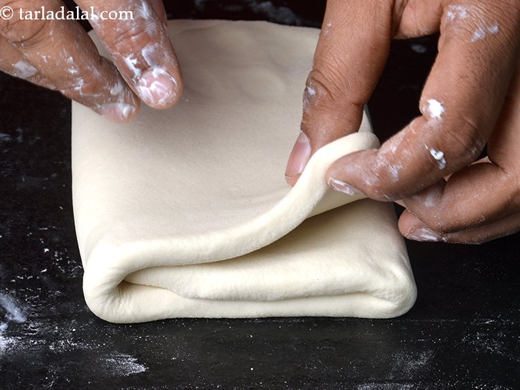 Step 13 – Again fold one side of the rectangle till the centre, then fold the other side …