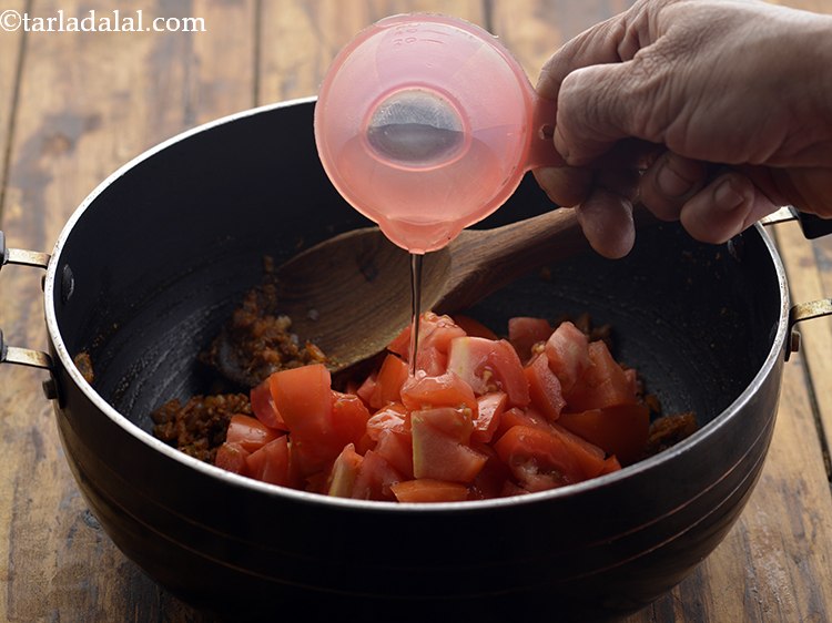 Step 20 – Also, add 2 tbsp of water which will help in cooking the tomatoes &amp; prevent …