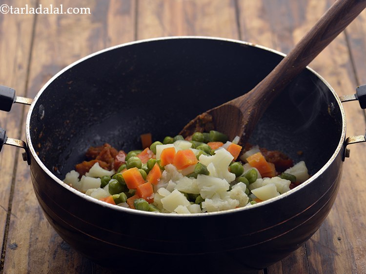 Step 22 – Add the mixed vegetables.