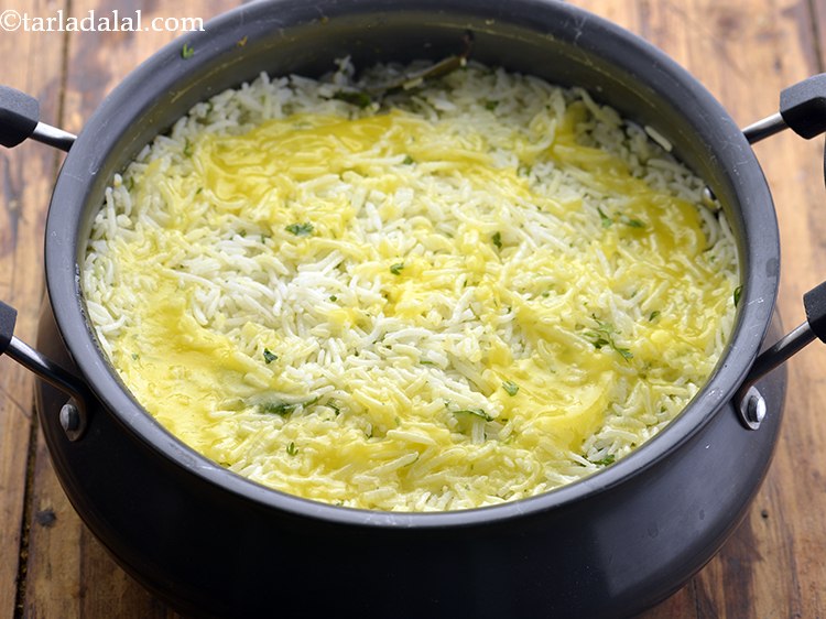 Step 38 – Pour the ghee evenly over it. If you don&rsquo;t like ghee, then drizzle milk.