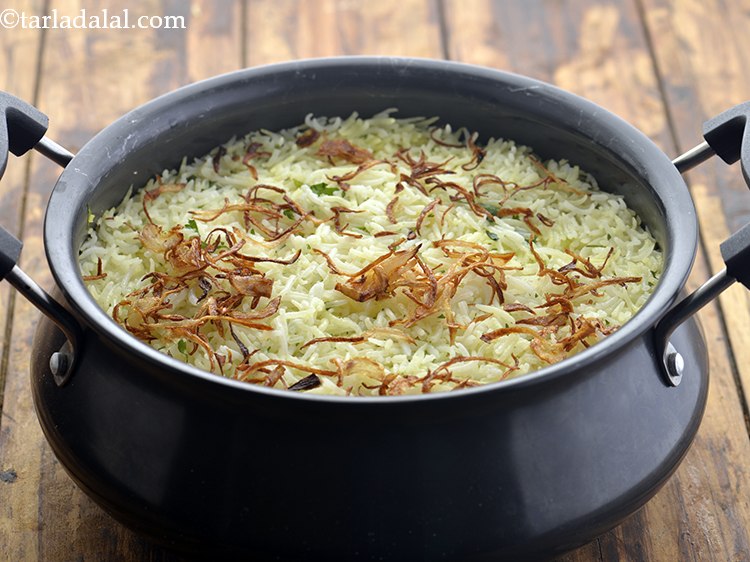 Step 41 – Garnish the <strong>vegetable biryani</strong> with fried onions.
