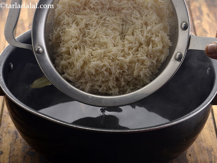 Step 6 – Transfer the soaked and drained rice.