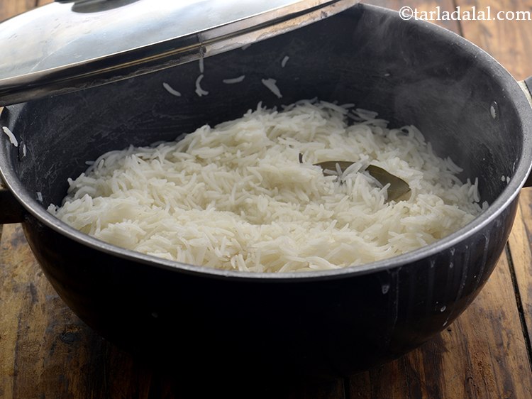 Step 7 – Gently stir the rice once. Cover with a lid and cook on a medium flame …