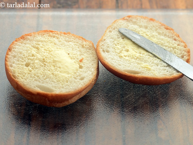 Step 30 – Apply &frac12; tsp of butter on the insides of each half of the burger bun.