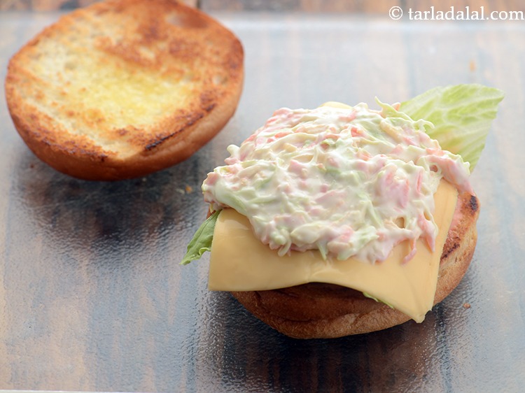 Step 37 – Now place a portion of the coleslaw over it.