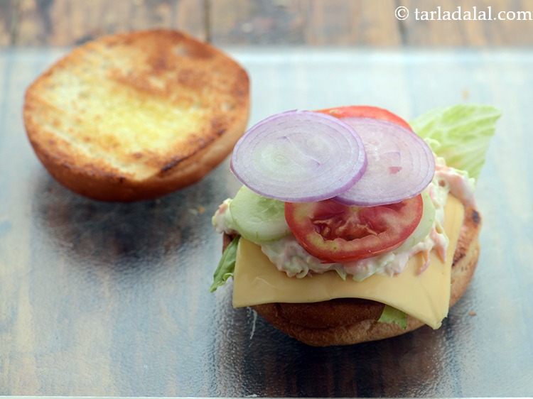 Step 40 – Place 2 onion slices. If you are Jain, skip adding it.
