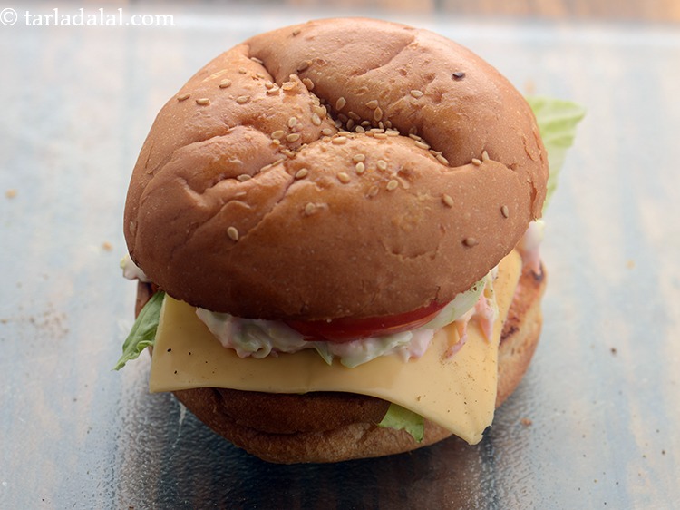 Step 42 – Cover it with the upper half of the burger bun with the buttered-spread side facing …