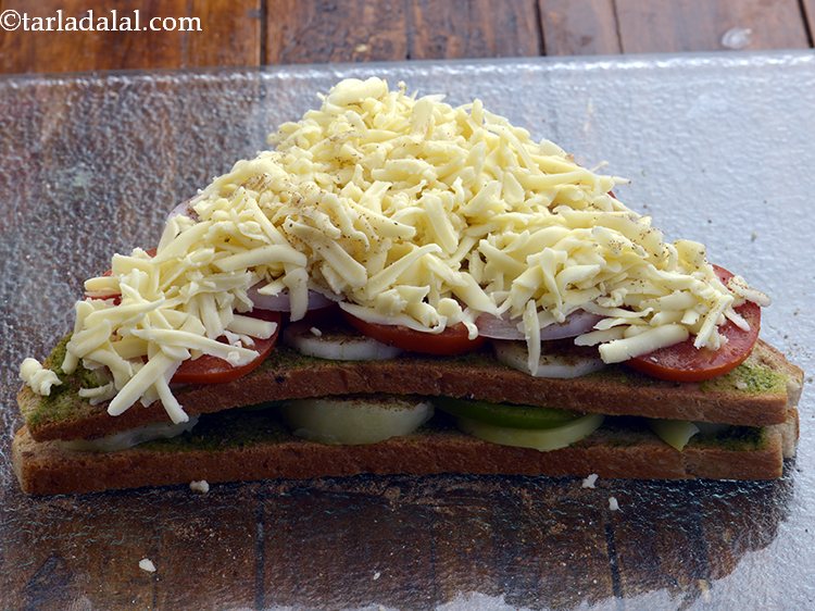 Step 14 – Sprinkle &frac12; cup of cheese evenly over it. We have used processed cheese but, you …