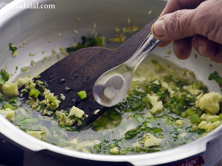 Step 22 – Add restricted quantity of salt. If you are cooking <strong>Dalia Khichdi </strong>for an infant (upto …