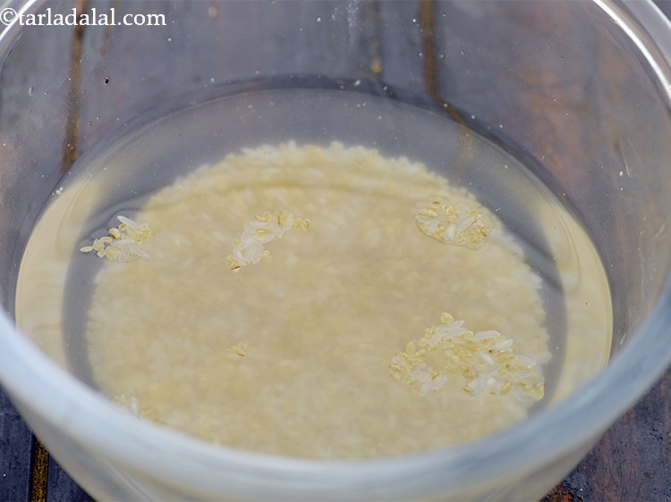 Step 9 – Add enough clean water and wash the dalia and rice.&nbsp;