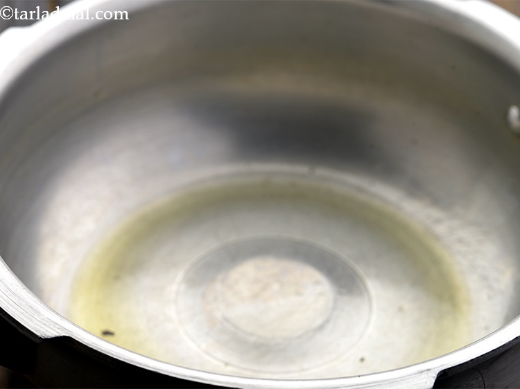 Step 12 – To temper <strong>Vegetable Dalia Khichdi for Babies and Toddlers</strong>, add &frac12; tsp of ghee into …