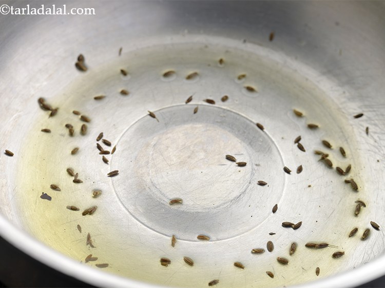 Step 13 – Add cumin seeds to it and let them crackle. Cumin seeds, also called as jeera …
