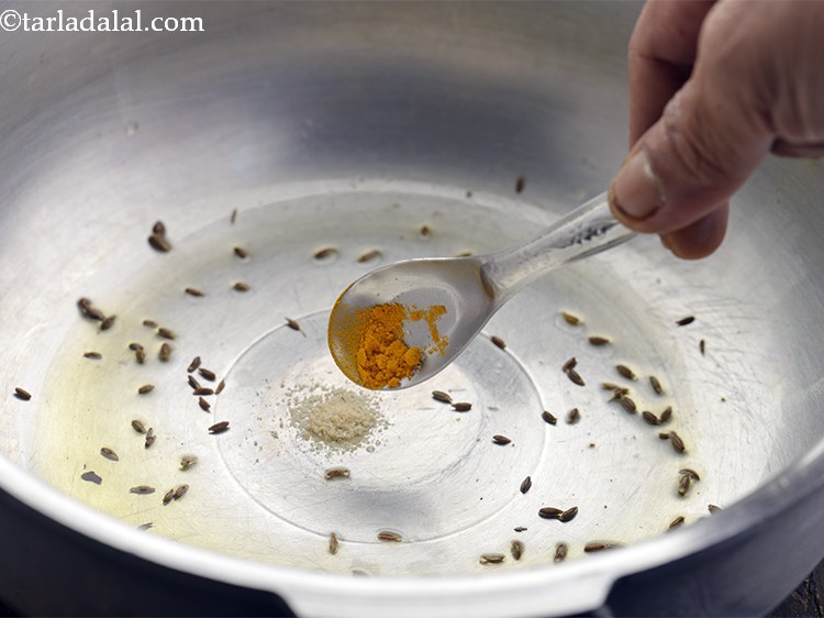 Step 15 – Immediately add little turmeric powder.&nbsp;