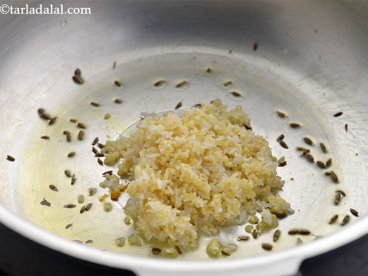 Step 16 – Follow it by the addition of washed dalia and rice.&nbsp;