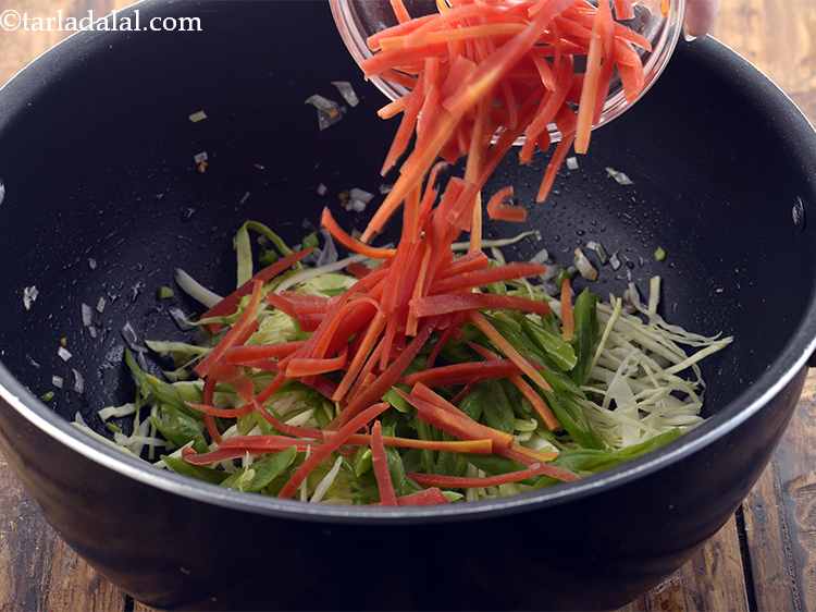Step 22 – Add the carrots. You can even add mushrooms, baby corns, broccoli or bean sprouts.