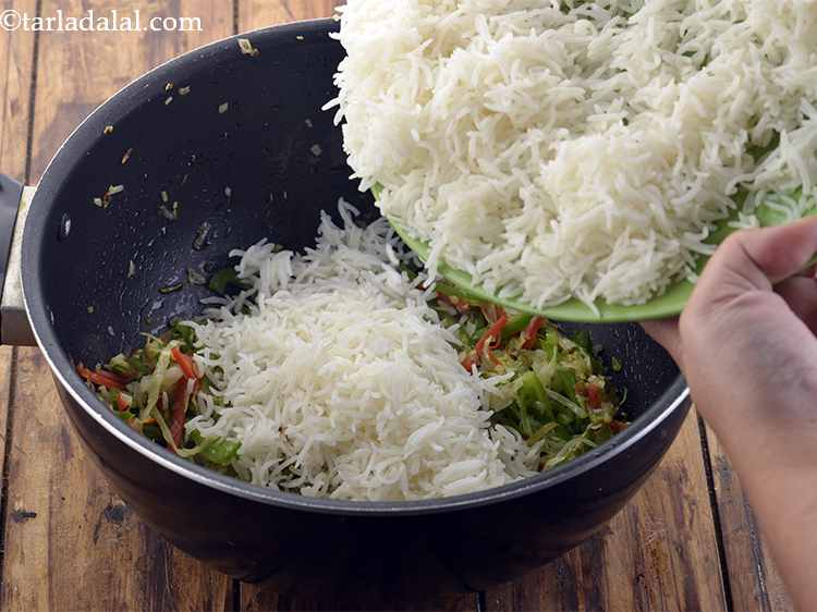 Step 25 – Now add the rice. Ensure that cooked rice does not have any lumps in it …