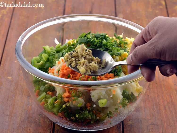 Step 9 – Then add the finely chopped ginger to it. You can also grate the ginger.