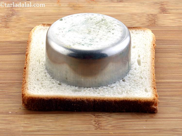 Step 17 – Place a 62 mm. (2&frac12;&rdquo;) diameter cookie cutter on the centre of the bread. If …