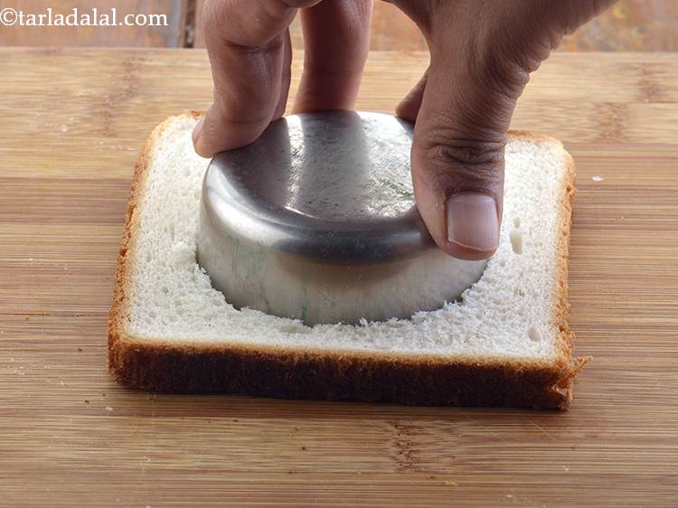 Step 18 – Press down on the bread slice and rotate to get the bread roundels.&nbsp;Repeat the same …