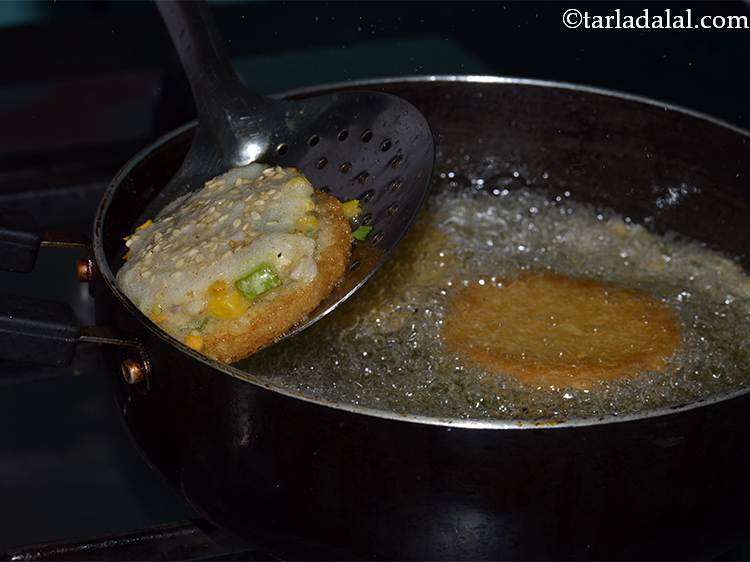 Step 25 – Deep fry them till they turn golden brown in colour from both the sides.Be very …