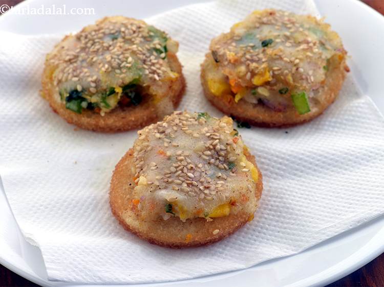 Step 26 – Drain on an absorbent paper. Repeat the same with the remaining&nbsp;<strong>Vegetable Gold Coins.</strong>