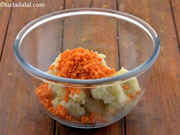 Step 3 – Then add the finely chopped carrots to it for crunch.