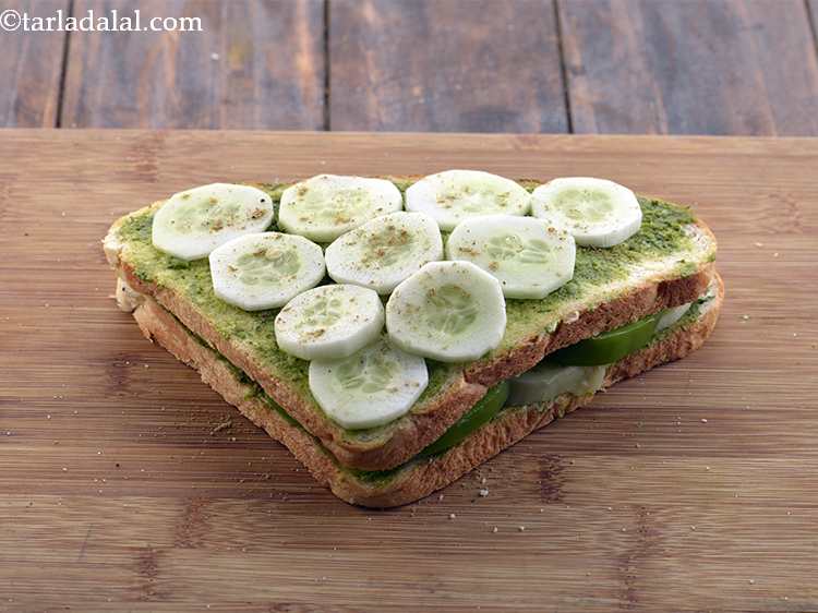 Step 10 – Sprinkle some sandwich masala and salt evenly over it.