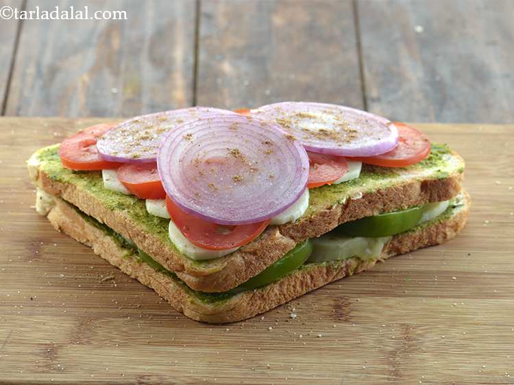 Step 13 – Again sprinkle some sandwich masala and salt evenly over it.