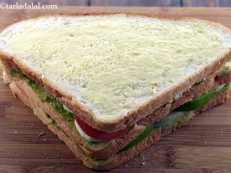 Step 15 – Spread a little butter on the bread slice all over.