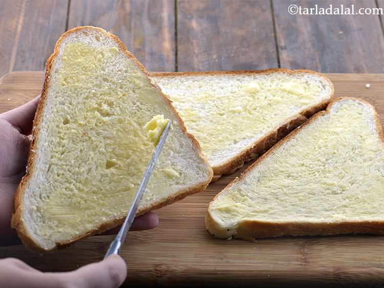 Step 2 – Apply 1&frac12; tsp of butter on 3 bread slices, 1/2 on each bread slice. Make …